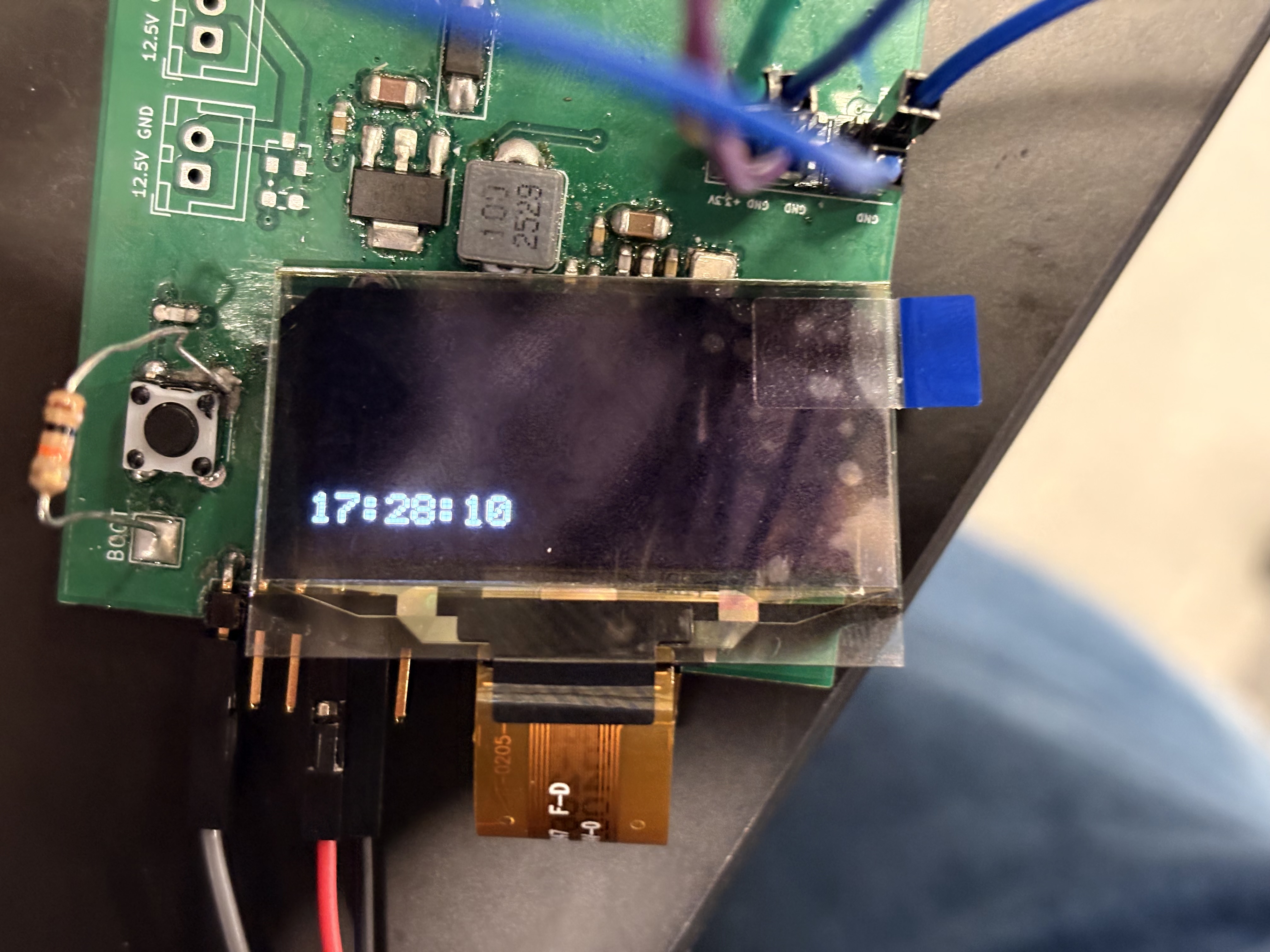 PCB with OLED HUD displaying time over BLE